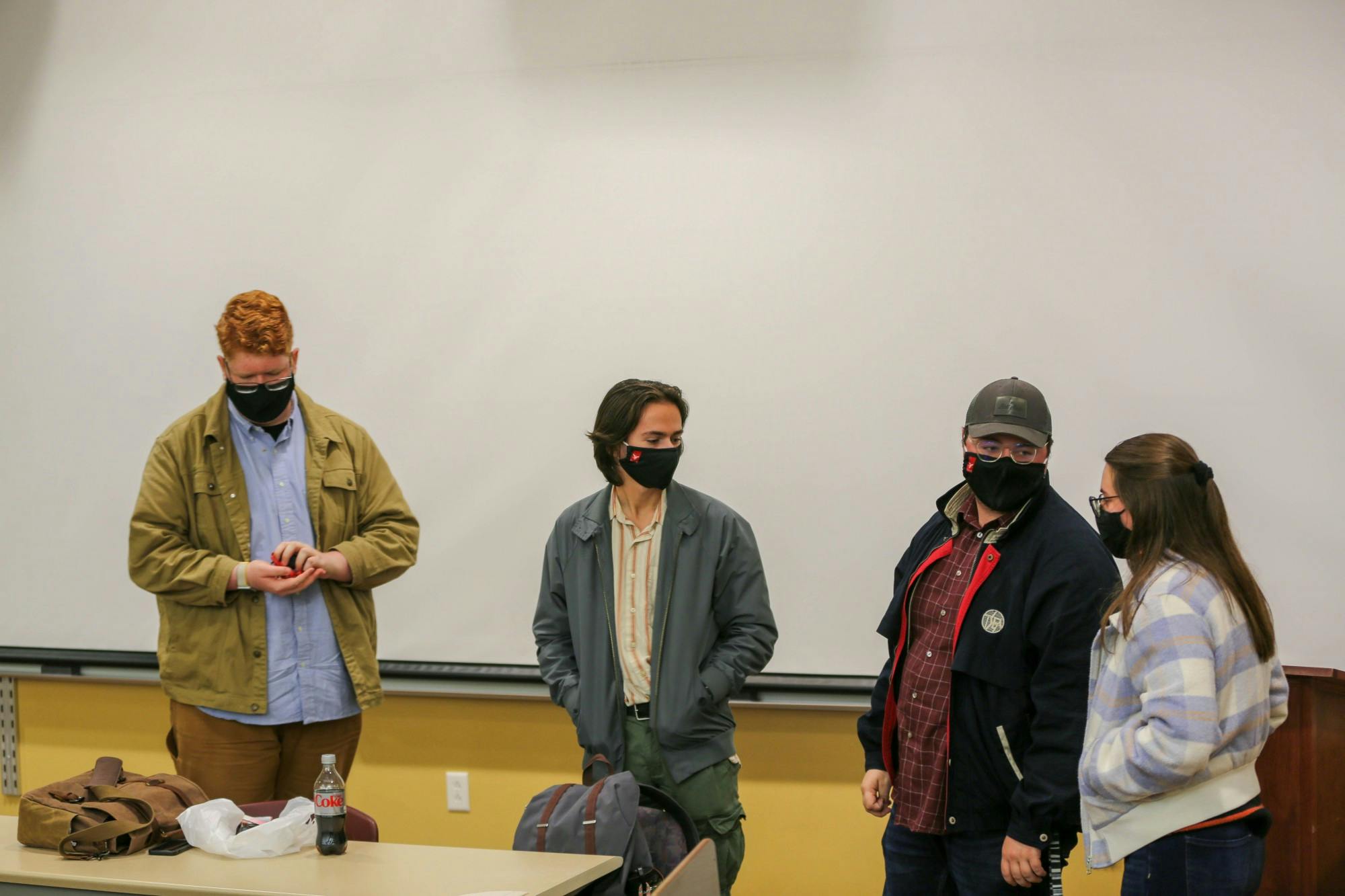Luke Hinesley, Sam Schlatter, Andrew Haines and Amelia Brewers, members of the Ball State Young Democratic Socialists of America (YDSA), talk after the organization&#x27;s town hall meeting Oct. 28. YDSA is calling for the university to raise the minimum wage for on-campus undergraduate student employees to at least $9 an hour. Eli Houser, DN