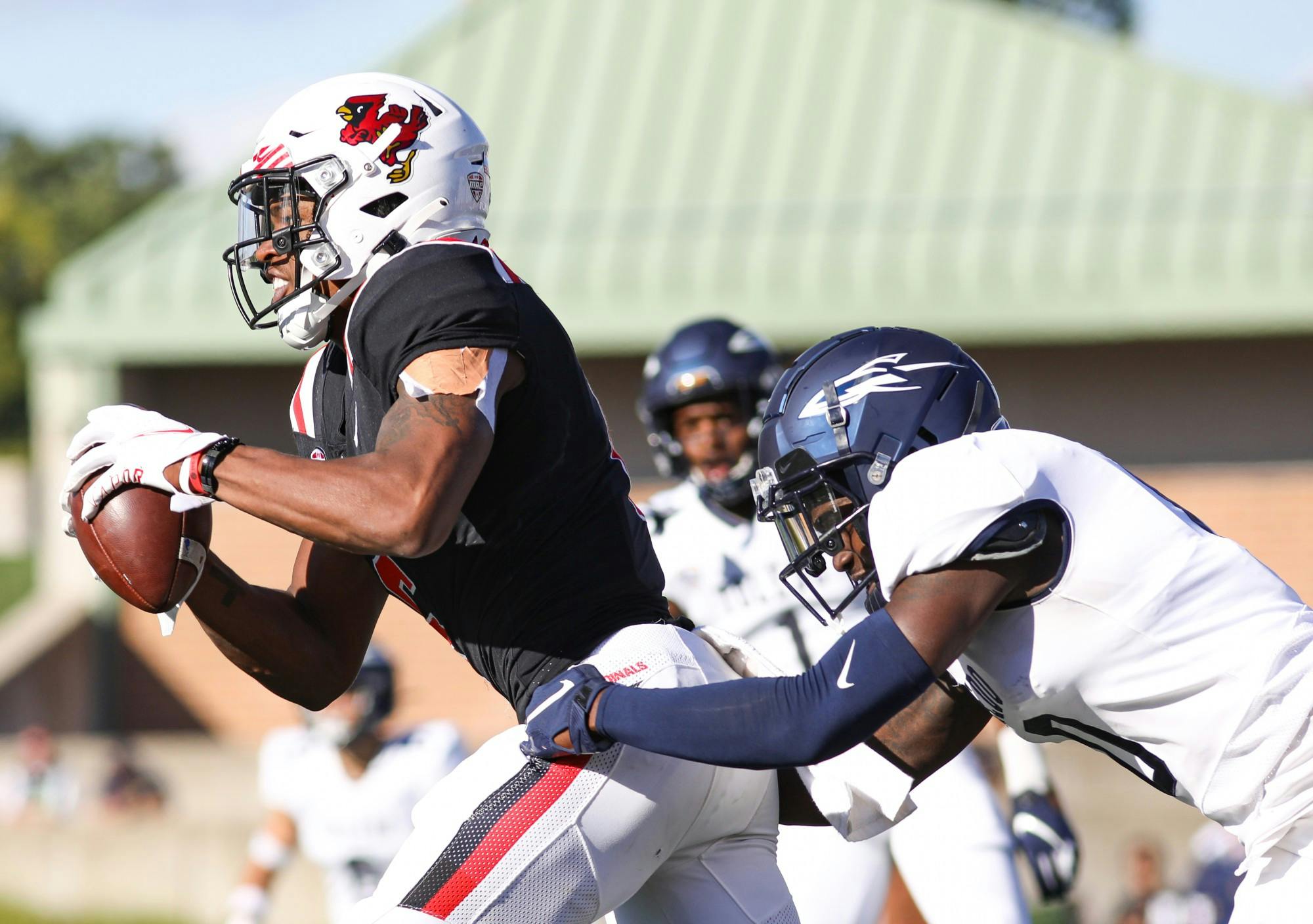 Senior wide receiver Yo'Heinz Tyler (6) pushes with the Toledo defender to get to the endzone at Scheumann Stadium Sept. 25. Ball State fell to Toledo 22-12. Jacy Bradley, DN