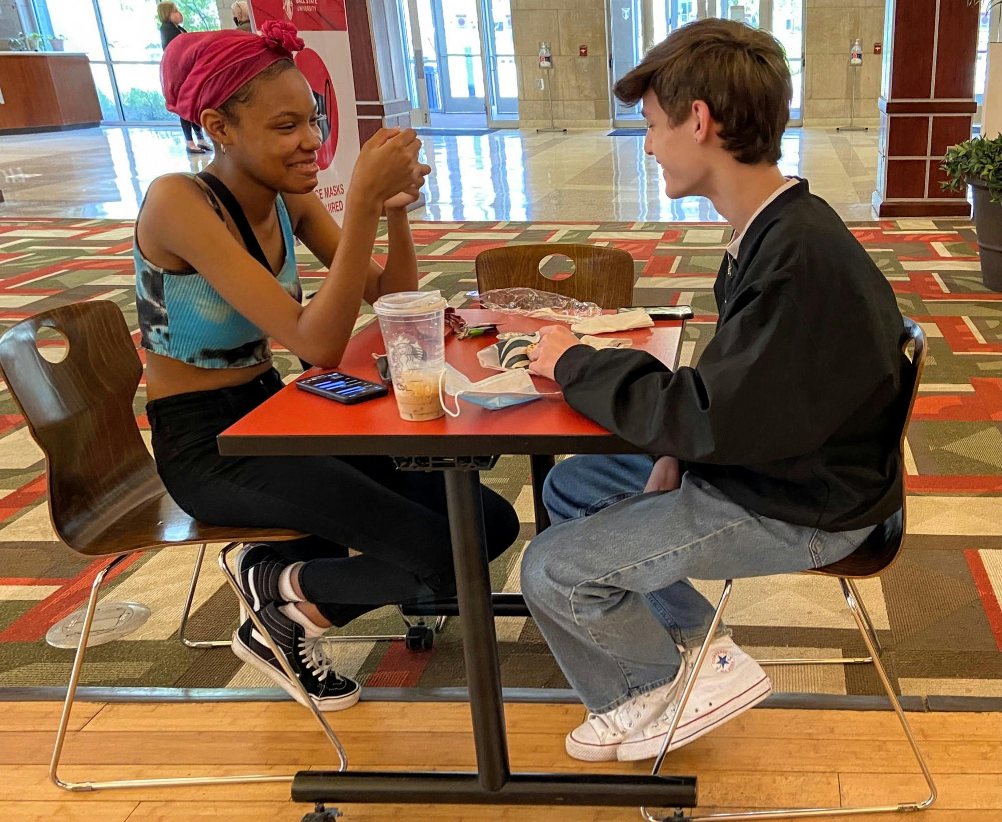 Indiana Academy juniors Simone-Mone&#x27;t Brown and Jameson VanBelkum have lunch at the Student Center Starbucks May 10, 2021. The Student Center Tally Food Court and Starbucks are the only dining options on Ball State&#x27;s campus open for all summer months. Grace McCormick, DN