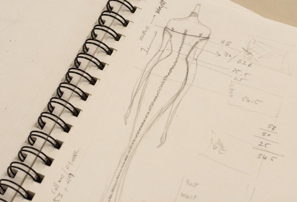 Christopher Atkinson, Ball State junior, sketches out his design for his upcoming clothing line on November 10, 2015 in Muncie, Indiana. (McKenzie Price - JOUR 235)