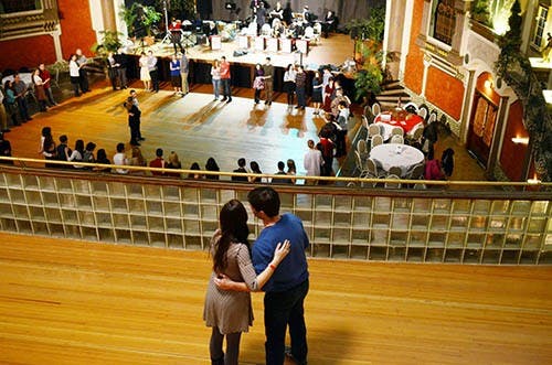 A couple embraces as they overlook the crowd attending the swing dance lessons. The group is composed of different levels of swing enthusiasts with the first part of the evening being a lesson, followed by an evening of dancing to live music. DN PHOTO MARIA STRAUSS