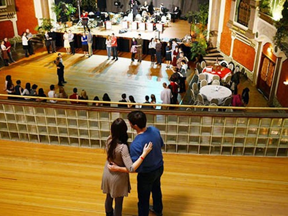 A couple embraces as they overlook the crowd attending the swing dance lessons. The group is composed of different levels of swing enthusiasts with the first part of the evening being a lesson, followed by an evening of dancing to live music. DN PHOTO MARIA STRAUSS
