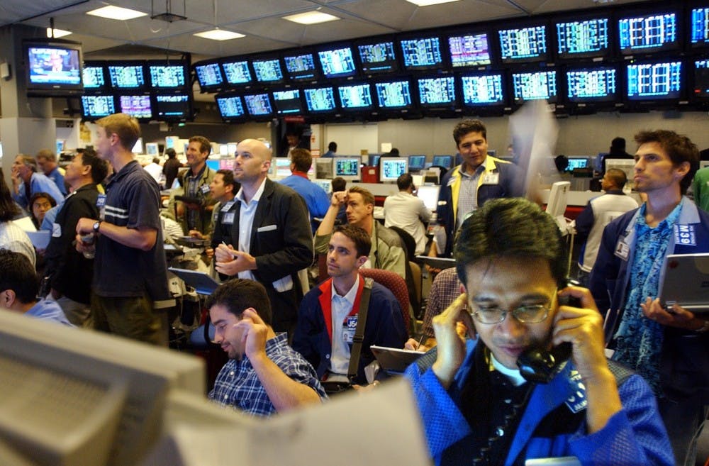 KRT BUSINESS STORY SLUGGED: FED KRT PHOTOGRAPH BY KARL MONDON/CONTRA COSTA TIMES (June 26) SAN FRANCISCO, CA -- Julian Maneein tries to hear a phone call over the din of traders at the Pacific Exchange on Wednesday, June 26, 2003, as the Federal Reserve cut a key short-term interest rate by one-quarter percent point, sending it to its lowest level in 45 years. The Dow Jones dropped over 75 points in the first hour after the announcement. (nk) 2003