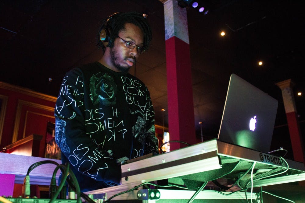 DJ Lavonte 'SPACExLION' Pugh sets audio levels while setting up for Dance This Mess Around on Jan. 21 at Mark III Taproom in downtown Muncie.&nbsp;Pugh will be one of the featured performers at Lantern EDM Night, a&nbsp;choreographed light show, at Be Here Now tonight. Grace Ramey // DN File