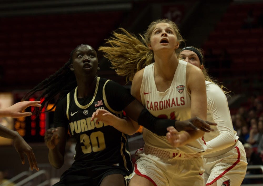 <p>Ball State Freshman Blake Smith prepares to catch the rebound shot while blocking Purdue Freshman Nyagoya Gony at the Ball State vs. Purdue Women's Basketball Game Nov. 7, 2018. The Cardinals lost 38- 80 <strong>Carlee Ellison, DN</strong></p>