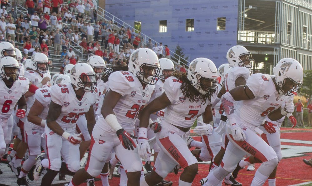 Members of the Ball State football team run onto the field before the game against Virginia Military Institute on Sept. 3 at Scheumann Stadium. DN PHOTO BREANNA DAUGHERTY