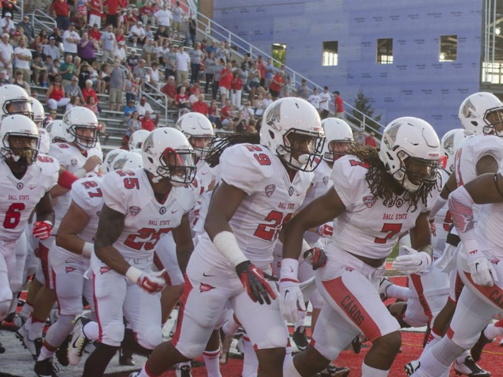 Members of the Ball State football team run onto the field before the game against Virginia Military Institute on Sept. 3 at Scheumann Stadium. DN PHOTO BREANNA DAUGHERTY