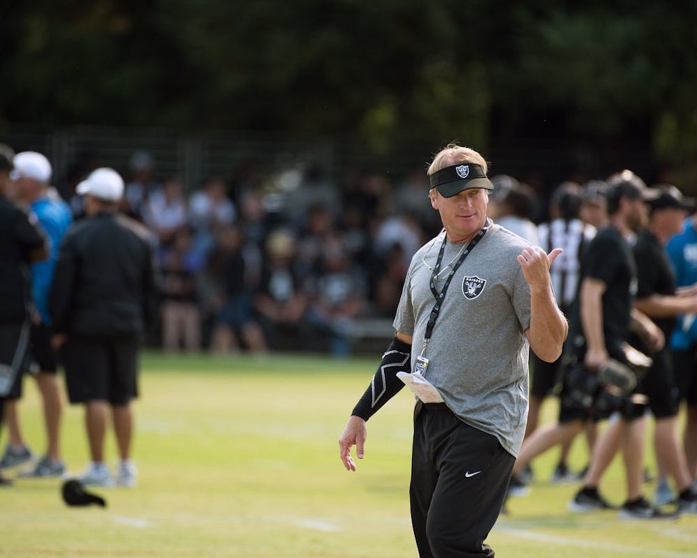 <p>Former Las Vegas Raiders head coach Jon Gruden leads a practice August 7, 2018. Gruden resigned Oct. 11 after the National Football League (NFL) investigation into the Washington Football Team for workplace misconduct found Gruden used homophobic, racist and misogynistic slurs in emails as recently as 2018. Gruden was in his fourth year with the Raiders. <strong>Louis Briscese/ US Air Force</strong></p>
