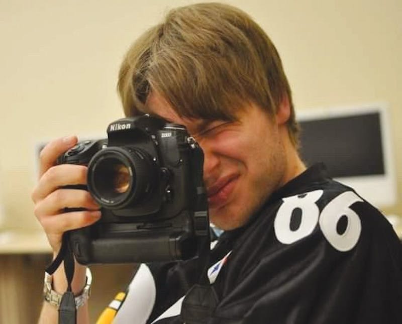 Ball State Creative Strategist Bobby Ellis uses his camera while he worked at the Daily News in 2010. Bobby Ellis, Photo Provided 