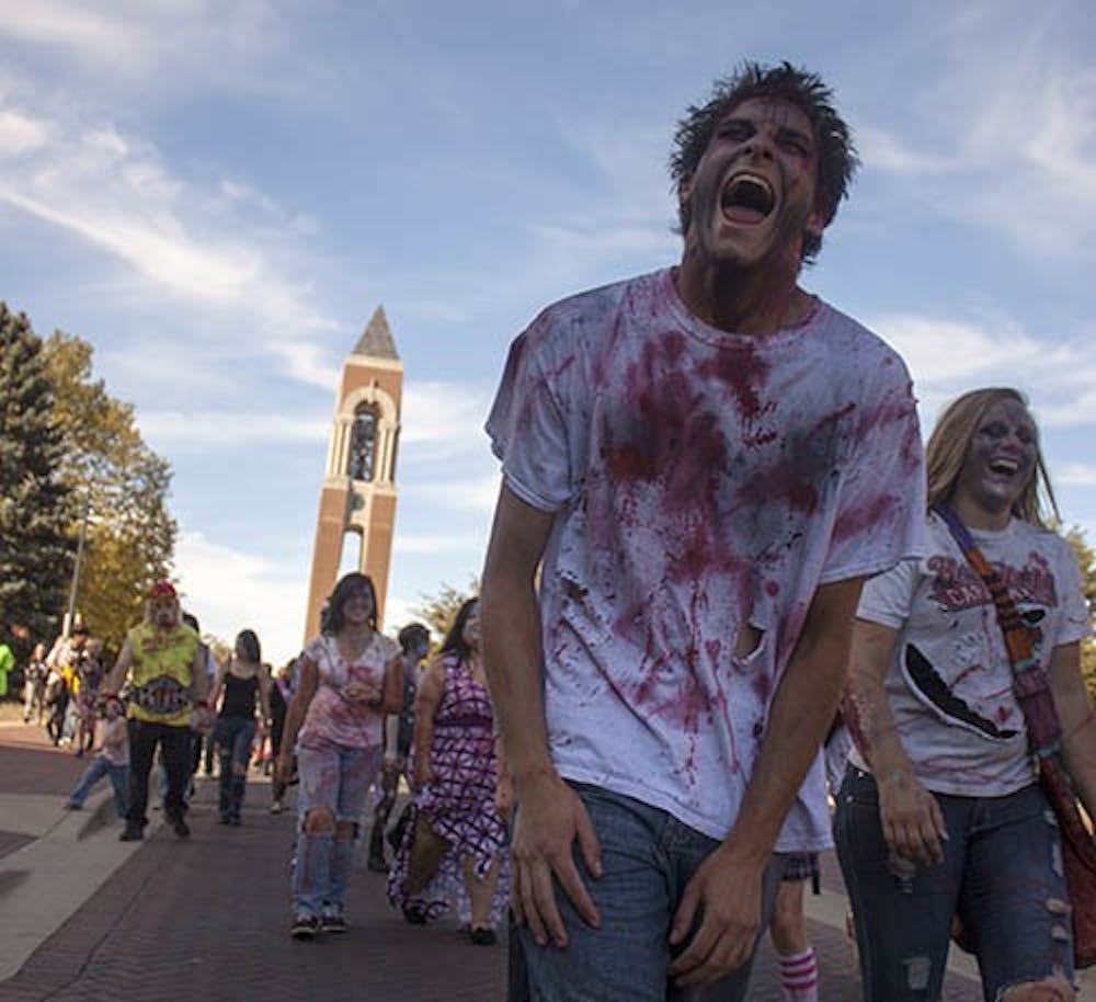 Zombie Walk participants make their way back to Ball State’s Quad on Sept. 14. The undead members raised awareness and money for Second Harvest Food Bank and Animal Rescue Fund. DN PHOTO COREY BAUTERS