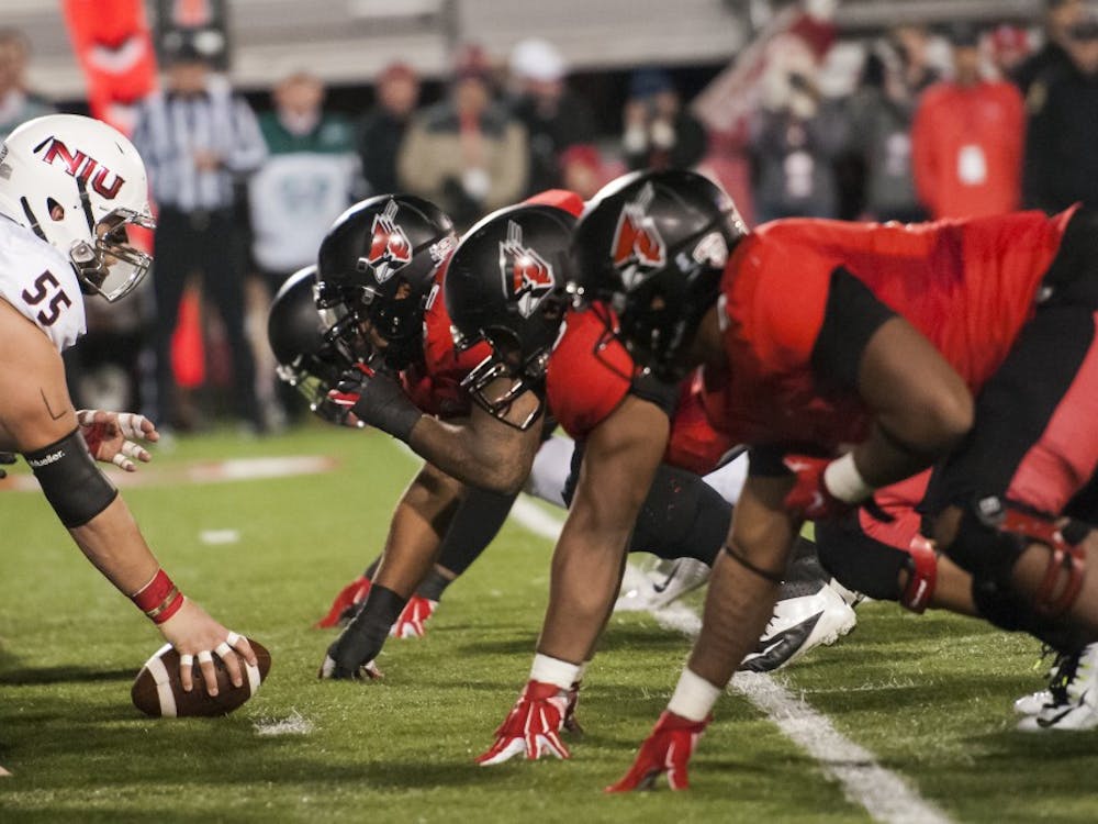 The defensive line awaits the snap during the game against Northern Illinois on Nov. 5 at Scheumann Stadium. DN PHOTO JONATHAN MIKSANEK