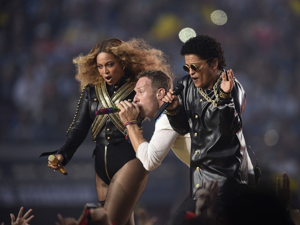 From left, Beyonce, Chris Martin of Coldplay, and Bruno Mars perform during the halftime show at Super Bowl 50 at Levi's Stadium in Santa Clara, Calif., on Sunday, Feb. 7, 2016. (Jose Carlos Fajardo/Bay Area News Group/TNS)