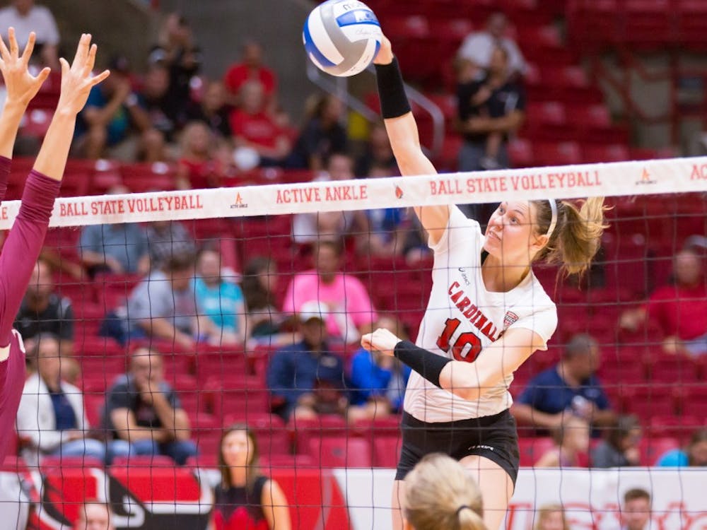 Sophomore outside hitter Ellie Dunn jumps up to spike the ball at the game against IUPUI on Aug. 31 at John E. Worthen Arena. Kyle Crawford // DN