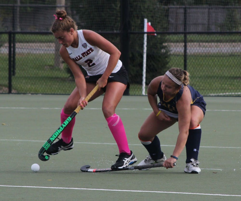 <p>Senior midfielder Carley Shannon attempts to get the ball around a La Salle defender at Briner Sports Complex on Oct. 16. &nbsp;Field Hockey plays home on Friday against Saint Louis. &nbsp;Patrick Murphy // DN File</p>