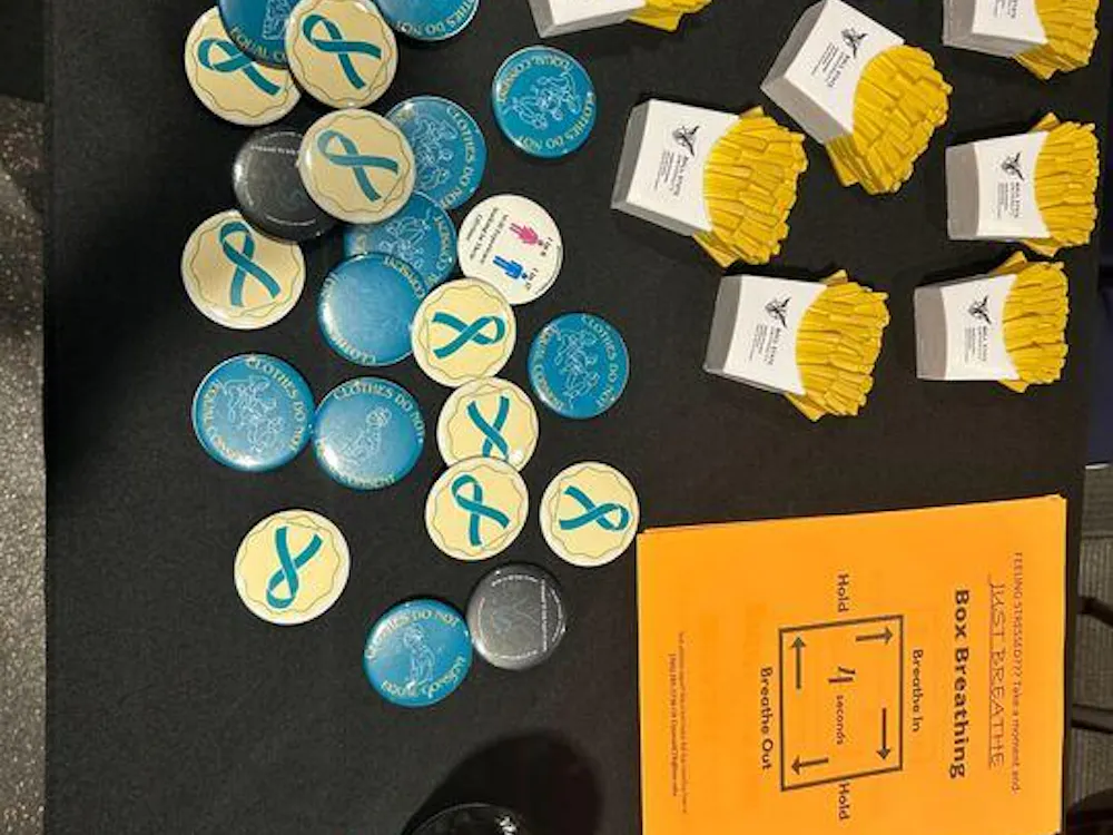 The Ball State Counseling Center table in the Jo Ann Gora Student Recreation and Wellness Center during the “What Were You Wearing” event on Wednesday, April 17. Victims of sexual assault are often asked what they were wearing which is a form of victim blaming. (Maya Kim, DN)