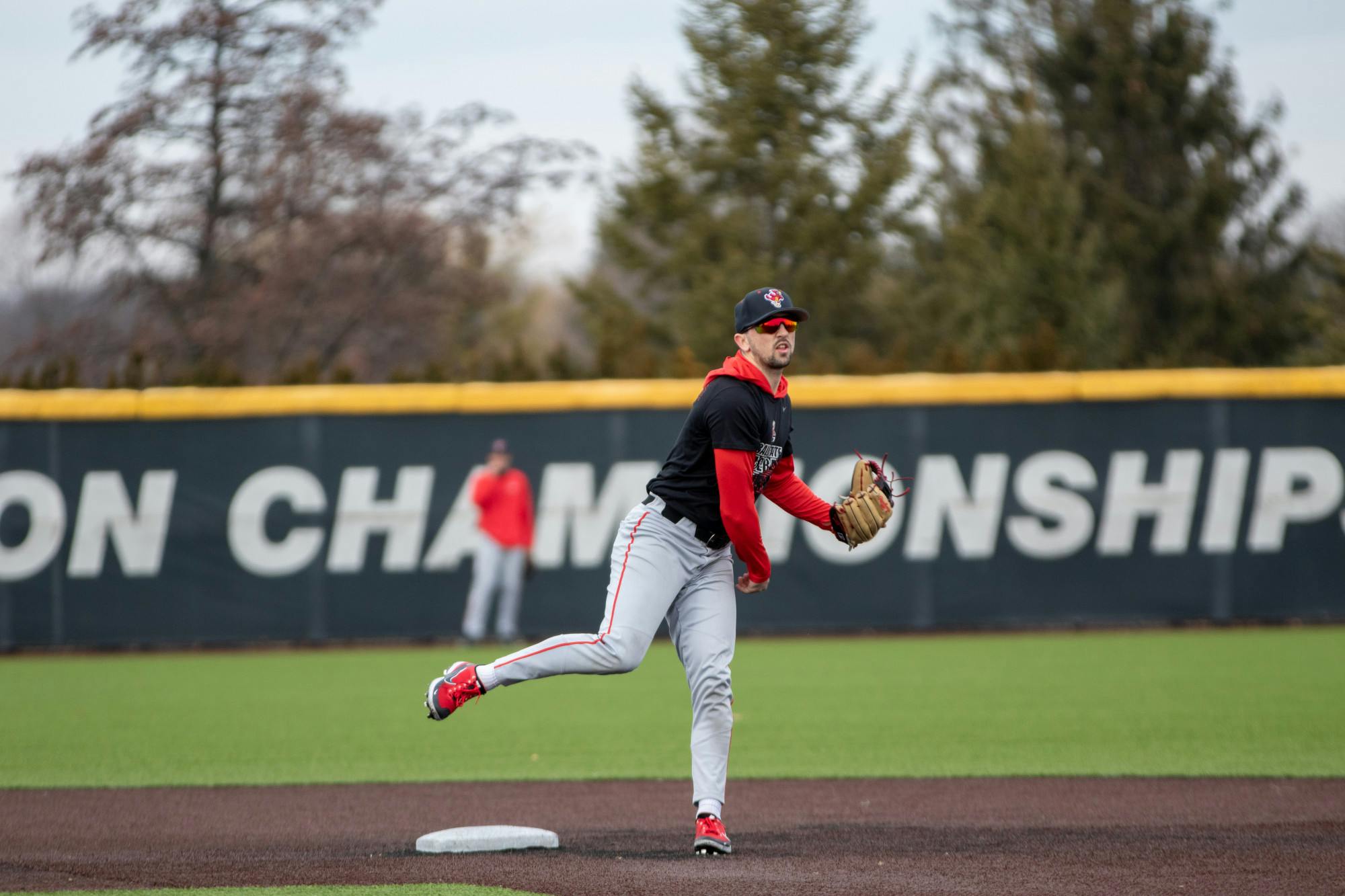 Graduate Student Infielder Justin Conant throws the ball to first in a practice Feb. 8 at First Merchant Ballpark. Brayden Goins, DN
