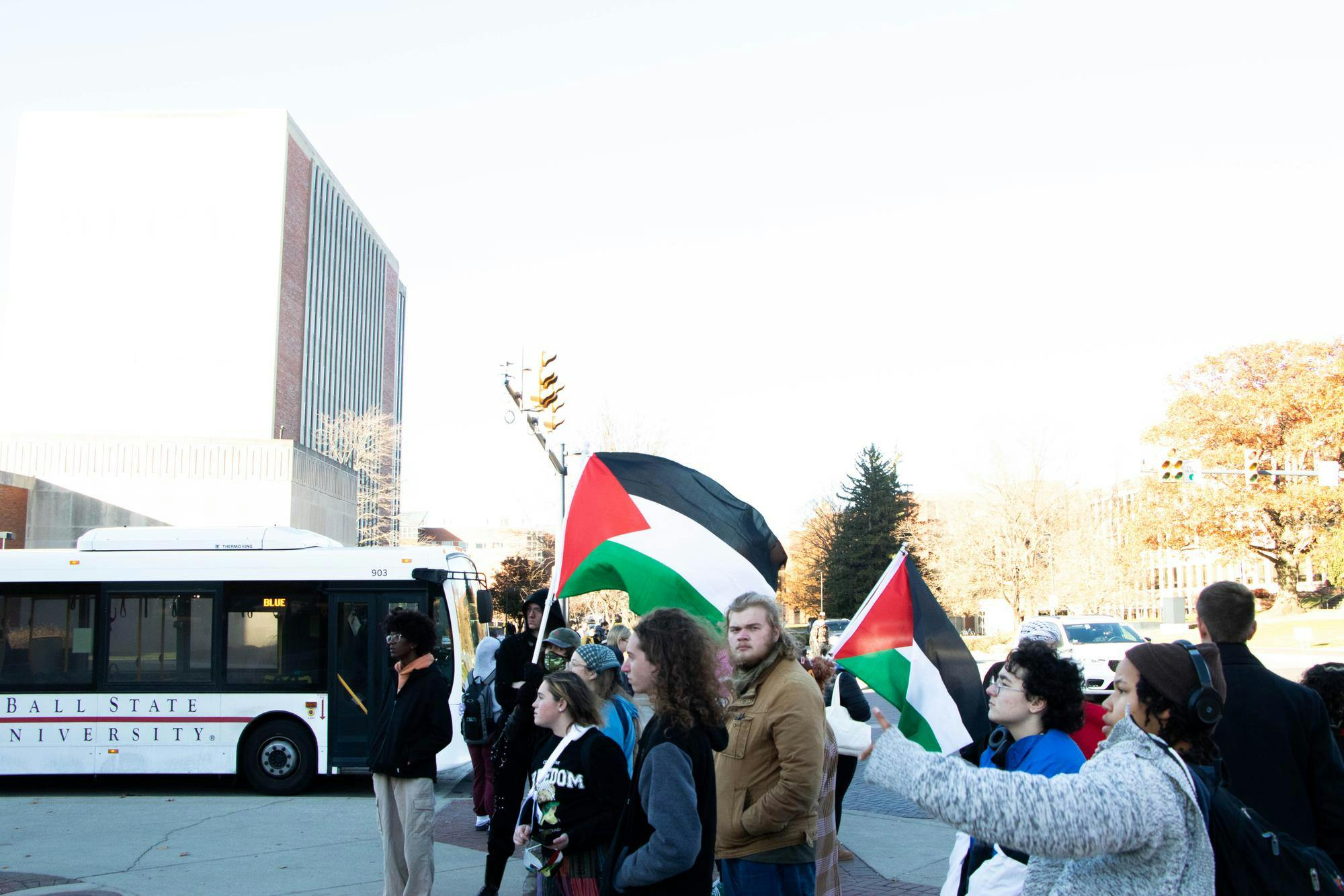 Protesters stand at the Scramble Light raising awareness for the hunger strike Nov.12. Will Baker, DN