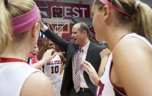 Head coach Brady Sallee lead the team in a cheer after the game. DN PHOTO BOBBY ELLIS
