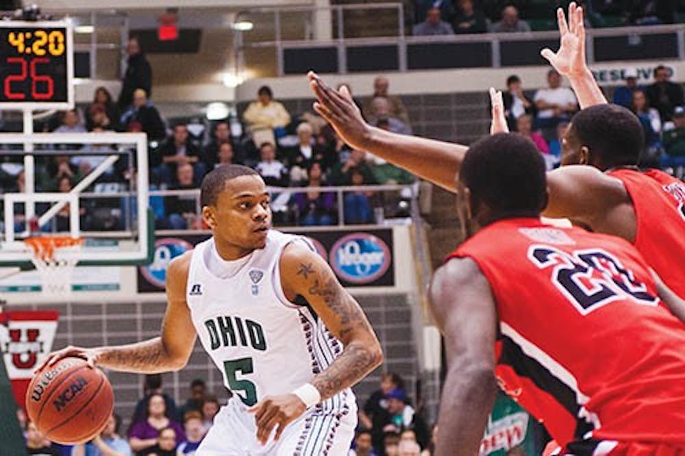 Ohio’s D.J. Cooper looks for an open pass during the Bobcats’ game against Ball State on Jan. 28, 2012. The Bobcats defeated Ball State 59-55. Cooper scores an average of 8 assists per game, which is the third highest in the nation in the nation. PHOTO PROVIDED BY BRIEN VINCENT AND THE POST