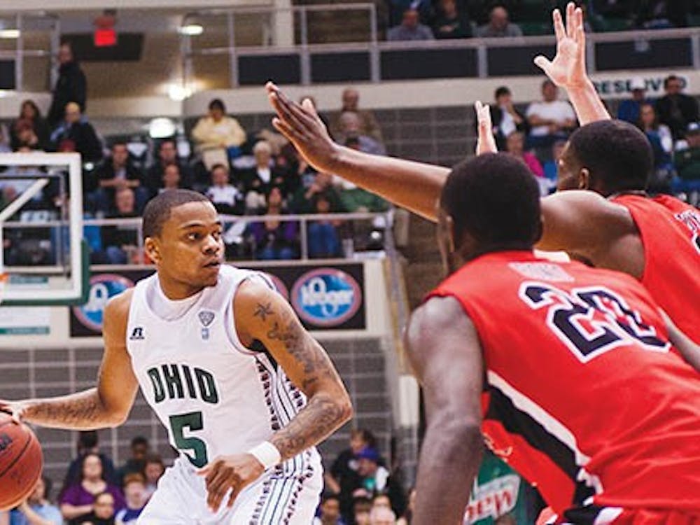 Ohio’s D.J. Cooper looks for an open pass during the Bobcats’ game against Ball State on Jan. 28, 2012. The Bobcats defeated Ball State 59-55. Cooper scores an average of 8 assists per game, which is the third highest in the nation in the nation. PHOTO PROVIDED BY BRIEN VINCENT AND THE POST