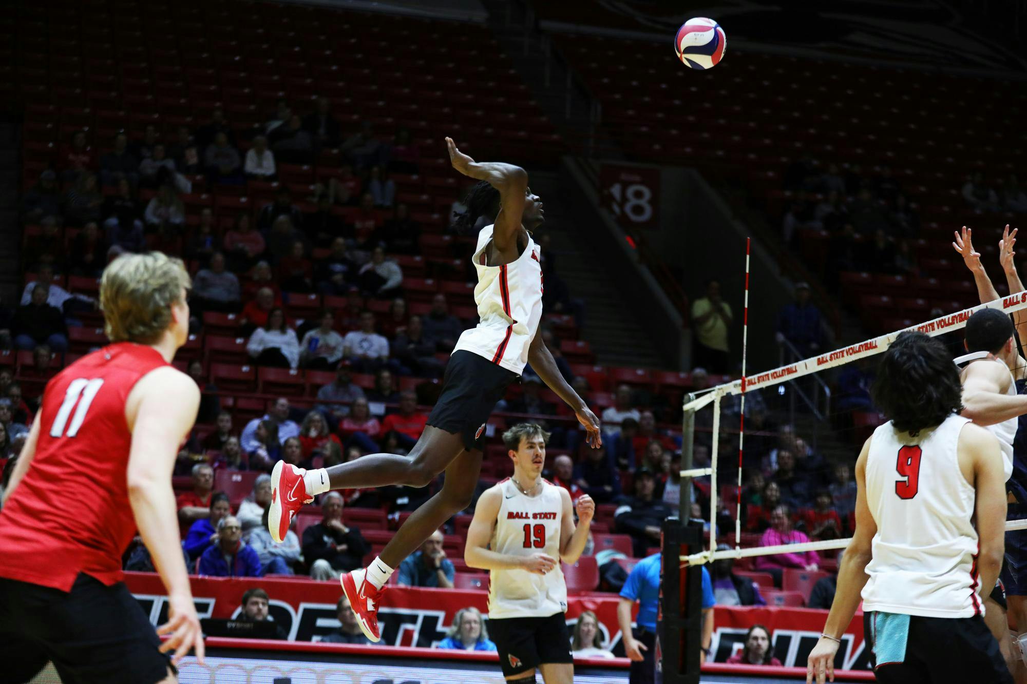 Junior opposite hitter Tinaishe Ndavazocheva jumps to spike the ball against Queens March 1 at Worthen Arena. Ndavazocheva scored 16 points in the game. Mya Cataline, DN