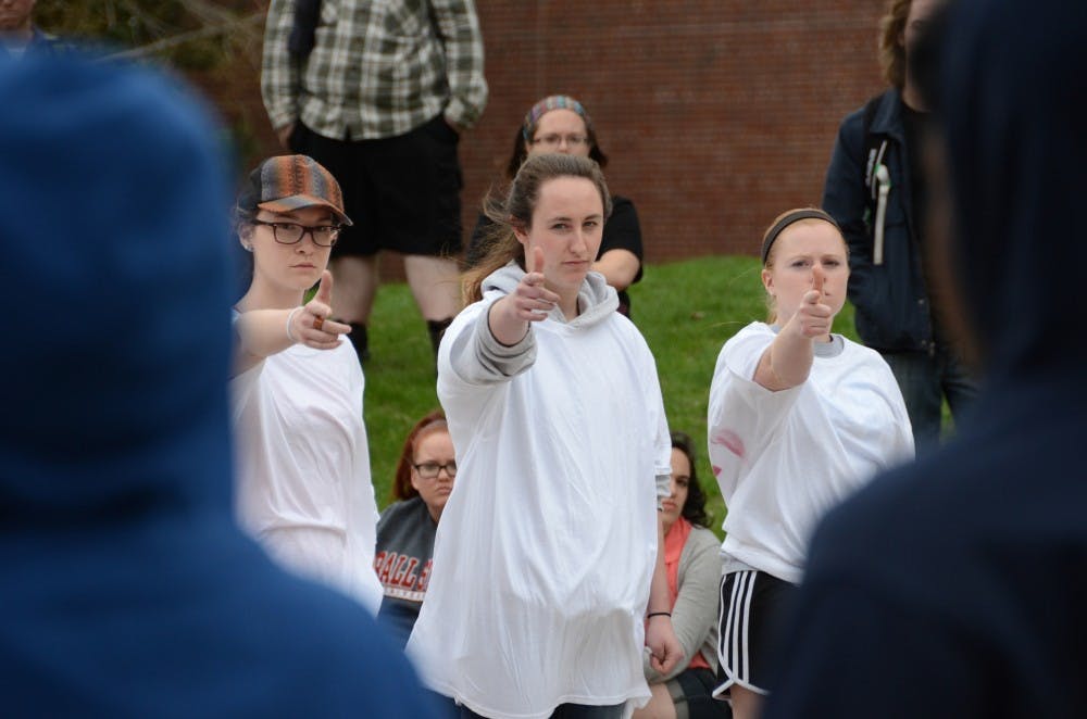 Theatre majors Abigal Michelle, Jessica Banaszak, and Jessica Morrison participated in the protest held by the Ethnic Theatre Alliance. Morrison said playing a role against her friends in ETA was unnerving. DN PHOTO LAUREN CHAPMAN 