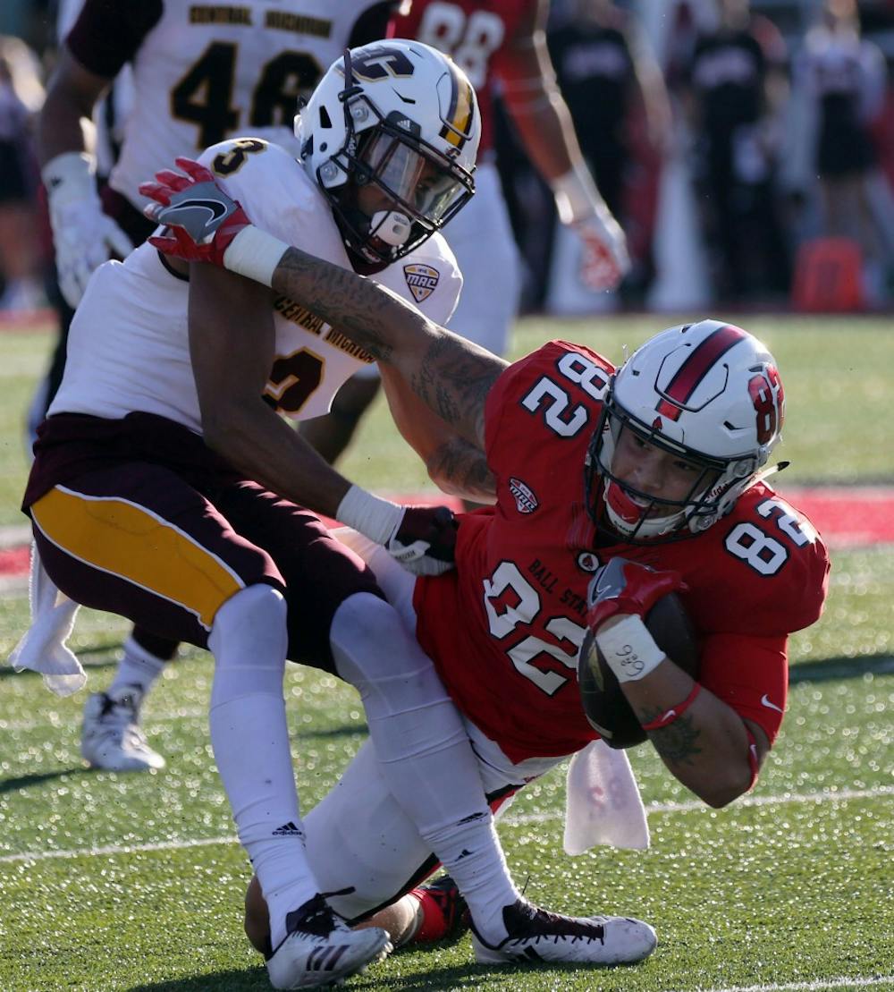 Redshirt freshman Keidren Davis gets tackled by Central Michigan’s Sean Bunting during the Cardinals’ game against the Chippewas on Oct. 21 at Scheumann Stadium. Ball State is playing Toledo Oct. 26 at home. Paige Grider, DN