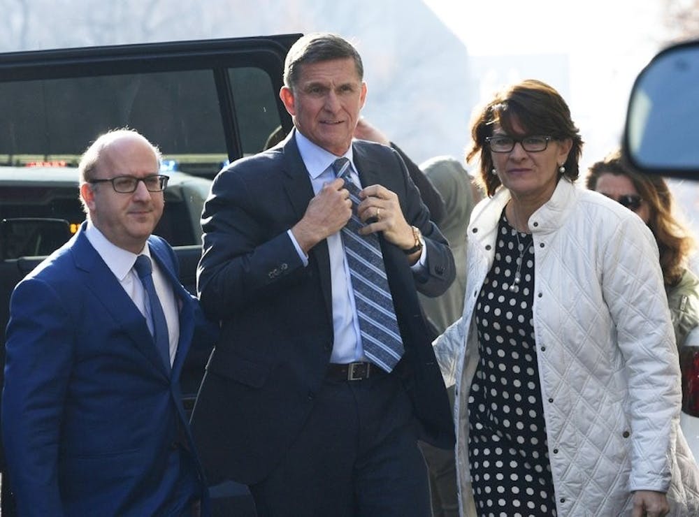 <p>Former Trump national security adviser Michael Flynn, center, arrives at federal court in Washington, Friday, Dec. 1, 2017. Court documents show Flynn, an early and vocal supporter on the campaign trail of President Donald Trump whose business dealings and foreign interactions made him a central focus of Mueller's investigation, will admit to lying about his conversations with Russia's ambassador to the United States during the transition period before Trump's inauguration. <strong>AP Photo</strong></p>