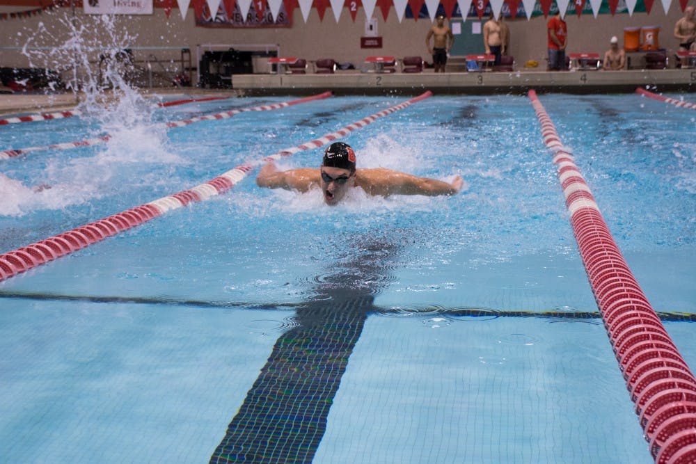 Senior, Jacob Eckert swims butterfly during the 200 yard individual medley at the Red and White Meet in the Lewellen Pool on Oct. 15, 2016.  The white team won 100-96. Kaiti Sullivan // DN
