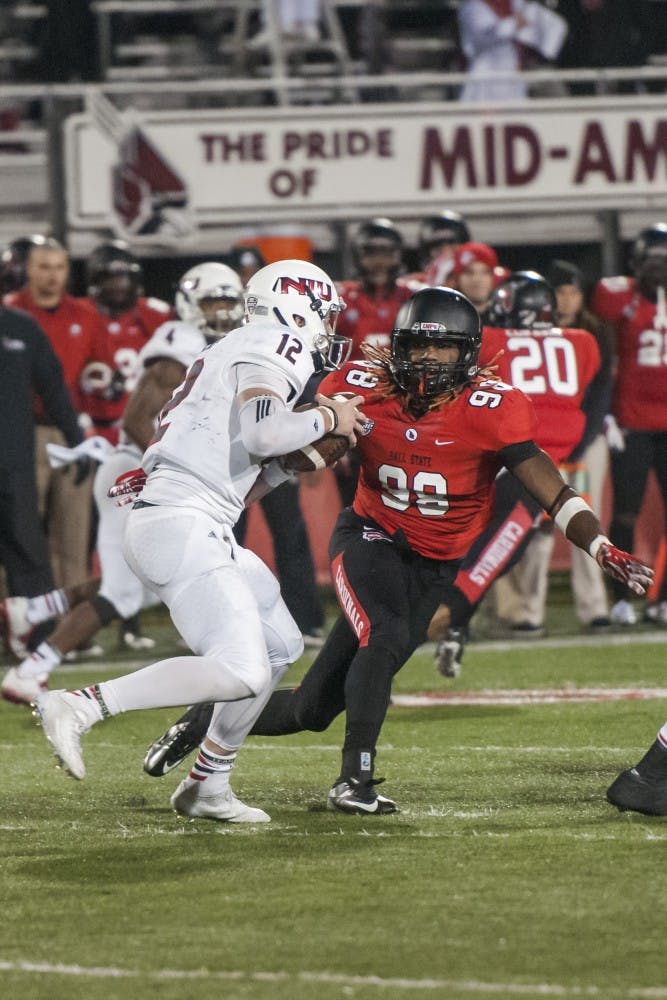 Freshman defensive lineman Anthony Winbush, pressures Anthony during the game against Northern Illinois on Nov. 5 at Scheumann Stadium. DN PHOTO JONATHAN MIKSANEK