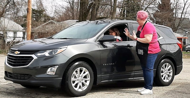 Misty Cougill, the owner of Let There Be Art, passes out art kits she made for children in the community March 18, 2020. These art kits included Crayola markers, glue sticks, scissors, pencils, construction paper and other crafty supplies. Misty Cougill, Photo Provided