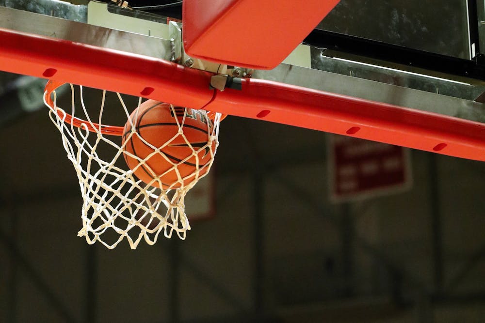 <p>A basketball falls through a hoop during the men&#x27;s basketball game at Worthen Arena on Feb. 4, 2022, in Muncie, IN. Ball State beat Toledo 93-83. Amber Pietz, DN</p>