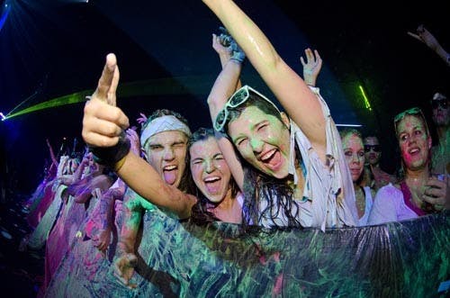 Students cheer as they are coated in paint from the Life in Color concert. The “World’s Largest Paint Party” came to Ball State on Nov. 10. Tickets, available to Ball State students only, cost $10-$15 for the sold-out event. Life in Color featured live disc jockeys and giant paint cannons to spray the crowds. The 2,500 students who attended the event entered Worthen Arena dressed in white and left covered in splatters of neon pink, green and blue paint. DN FILE PHOTO COREY OHLENKAMP