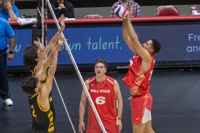 Graduate student Rodney Wallace jumps for a block against Lees-McRae Jan. 23rd at Worthen Arena. Wallace earned Academic All-Midwestern Intercollegiate Volleyball Association honors. Jayce Blane, DN