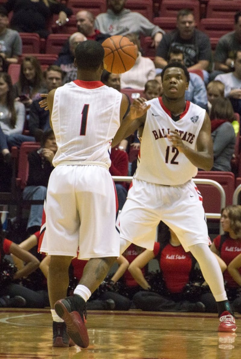 Sophomore guard Zavier Turner passes the ball to Junior forward Bo Calhoun during the game against Kent State on Jan. 24 at Worthen Arena. DN PHOTO ALAINA JAYE HALSEY