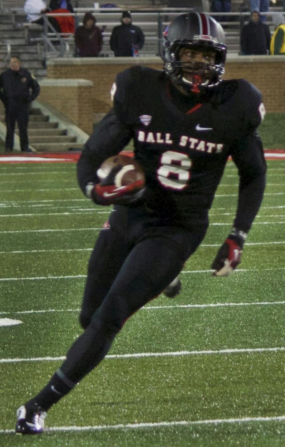 Ball State’s senior wide receiver Jordan Williams attempts to gain a few yards during the game against Bowling Green on Nov. 24 in Scheumann Stadium. DN PHOTO GRACE RAMEY