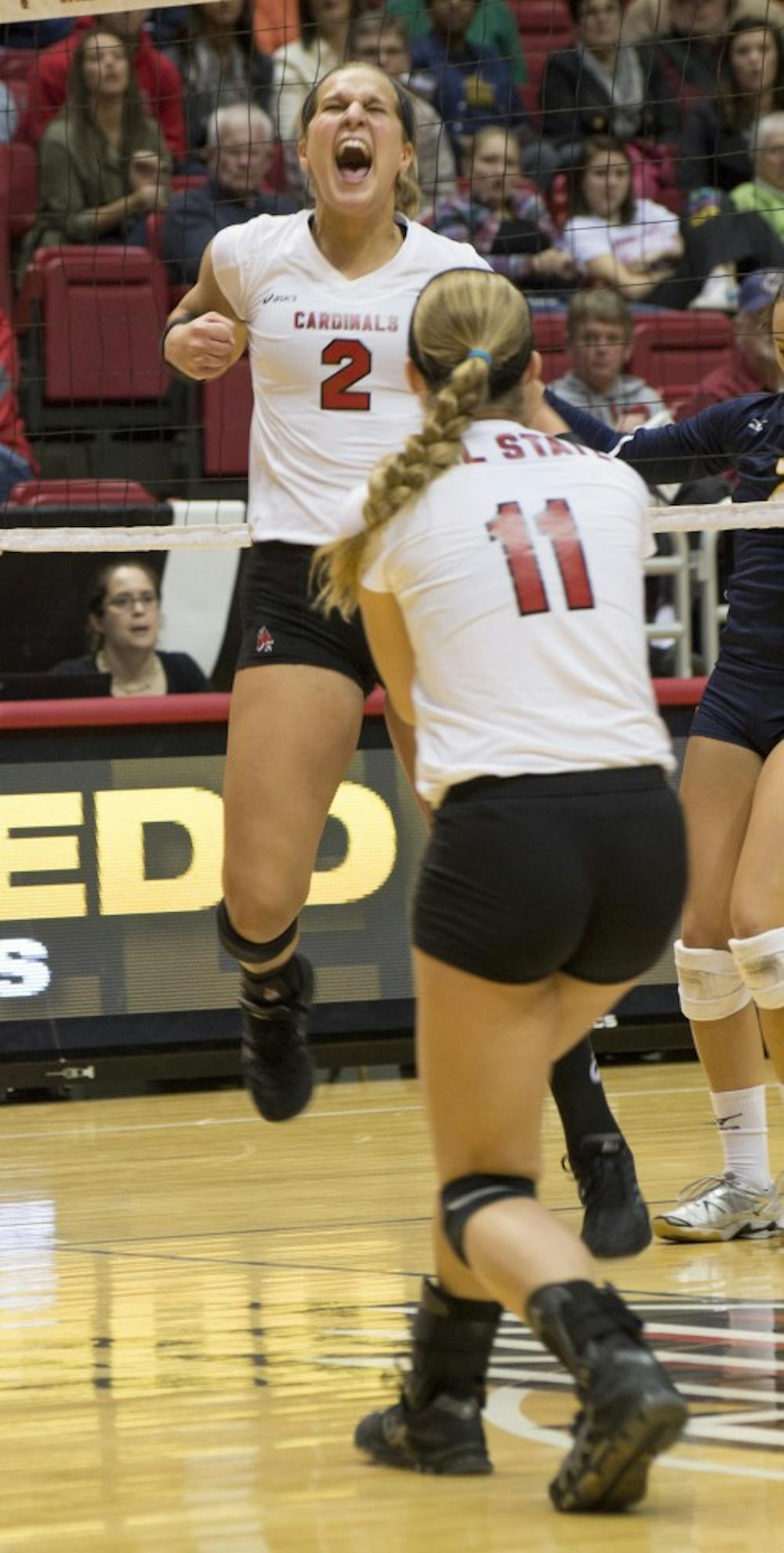 Sophomore outside hitter Alex Fuelling and senior setter Jacqui Seidel celebrate after getting a point at the match against the University of Toledo on Nov. 7 at Worthen Arena. DN PHOTO EMILY SOBECKI