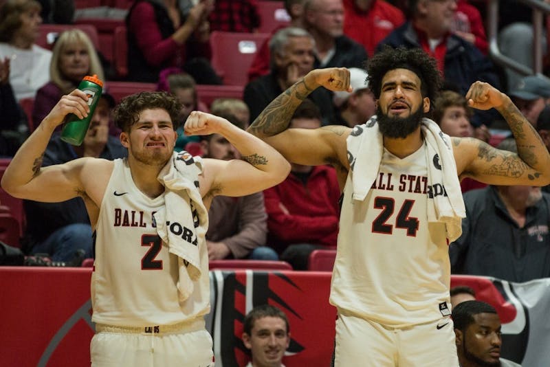 Seniors Tayler Persons and Trey Moses flex after Ball State scores on Toledo during the game in Worthen Arena Feb. 17, 2018. The Cardinals won 99-71. Eric Pritchett, DN File