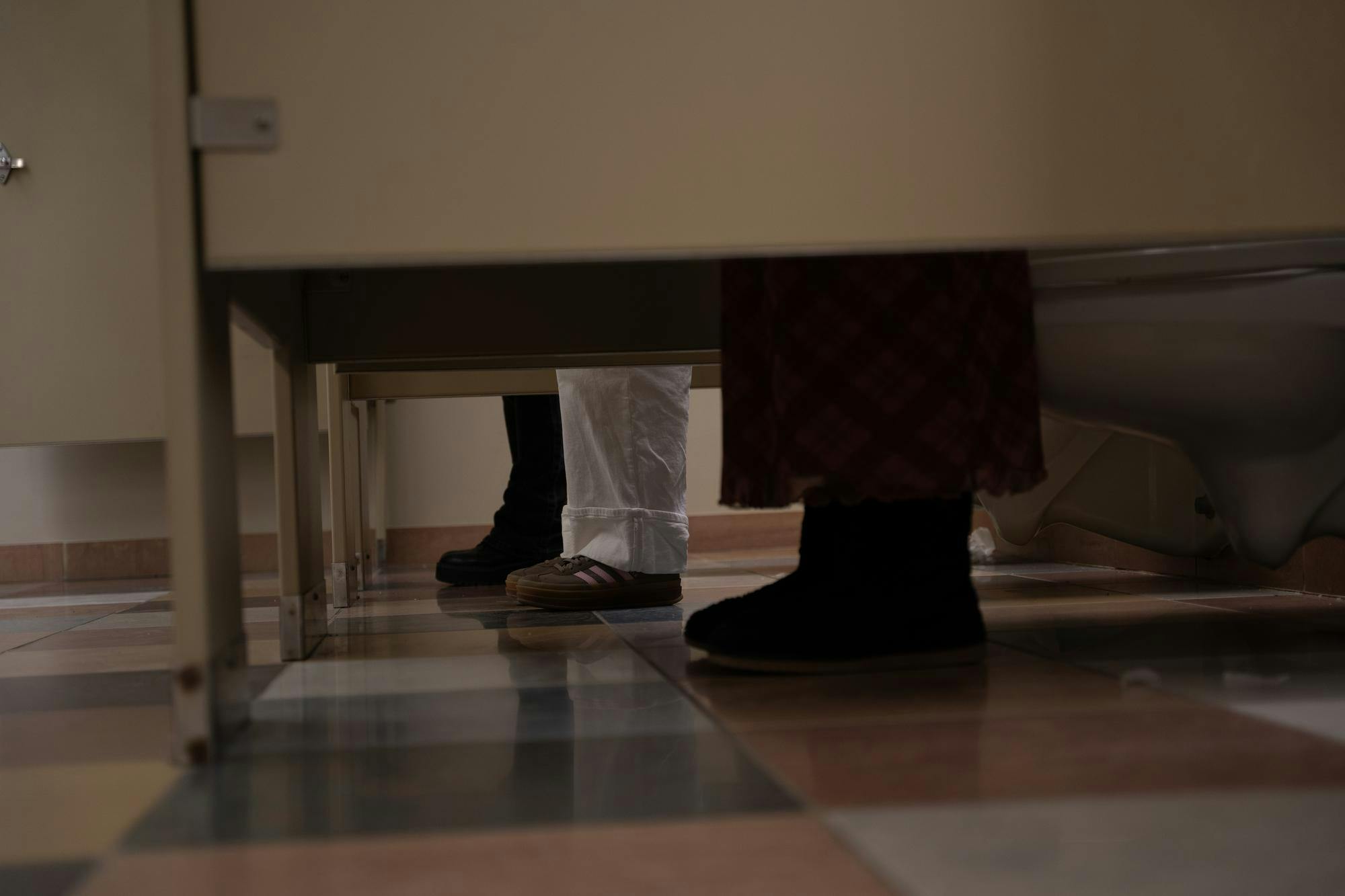 Ball State University students pose in the men's bathroom Feb. 4 in the Art and Journalism Building. Kyle Ingermann, DN