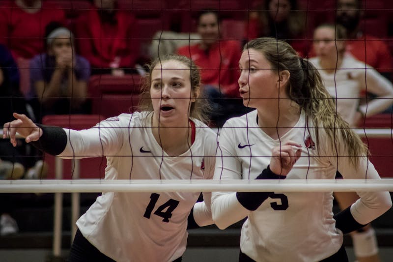 Ball State junior outside hitter Kia Holder talks with freshman middle blocker Marie Plitt before the next serve Nov. 16, 2019, in John E. Worthen Arena. The Cardinal's next game will be in Bowling Green, Ohio during the MAC volleyball championship. Eric Pritchett, DN