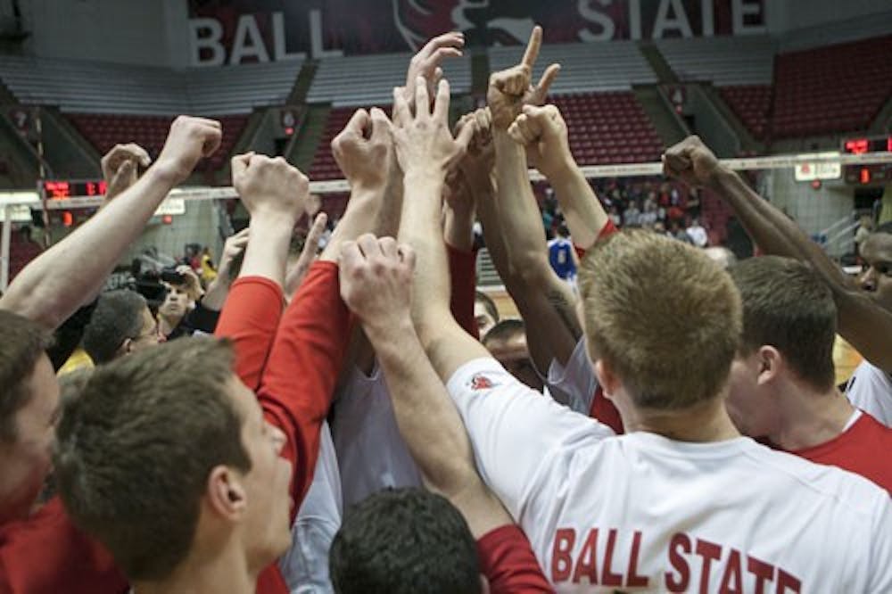 The members of the men's volleyball team celebrate their victory over IPFW on April 20, 2013. With this win, the Cardinals have a 21-5 recored and will advance to the next round of the MIVA Tournament. DN PHOTO JORDAN HUFFER