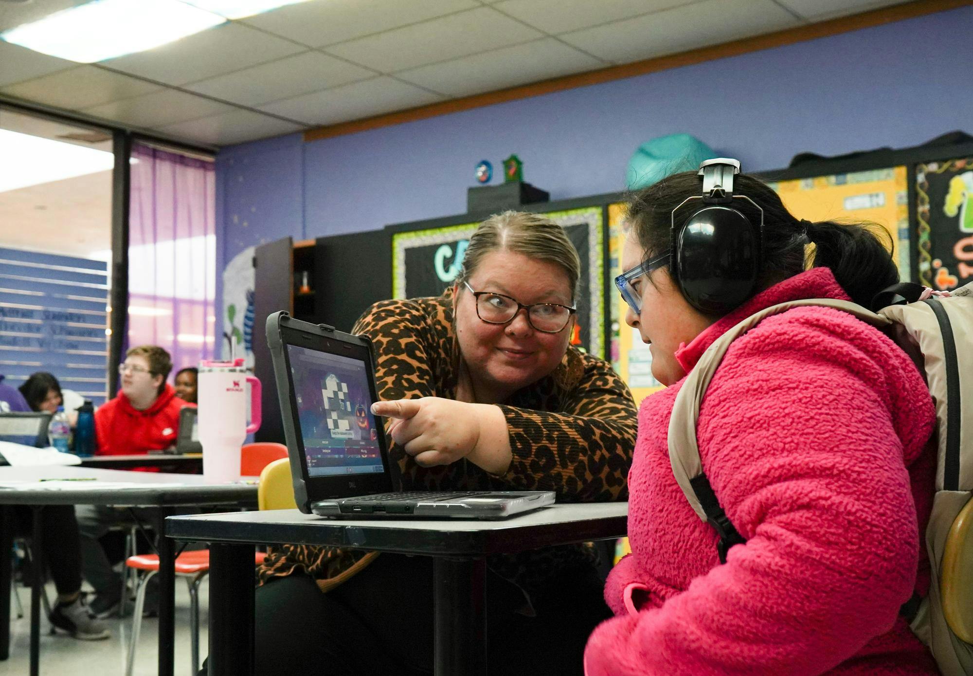 Teachers aid helps a student in Samantha Ivy’s special education class Oct. 30 at Muncie Central High School. Isabella Kemper, DN