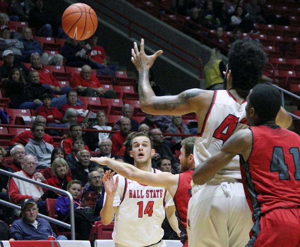 <p>Forward Kyle Mallers passes the ball to center Trey Moses during the Cardinals’ game against IU Kokomo on Nov. 29, 2016 in John E. Worthen Arena. Ball State won 92 to 52. <strong>Paige Grider, DN File</strong></p>