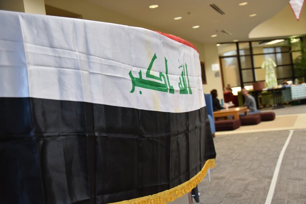 The Iraqi flag sits on a table at the "Because They Are Me" charity event on Nov. 5 at the Innovation Connector. The event was hosted by Muncie locals and refugees from Iraq in an effort to help ease the struggles of refugees in northern Iraq.&nbsp;Patrick Calvert // DN