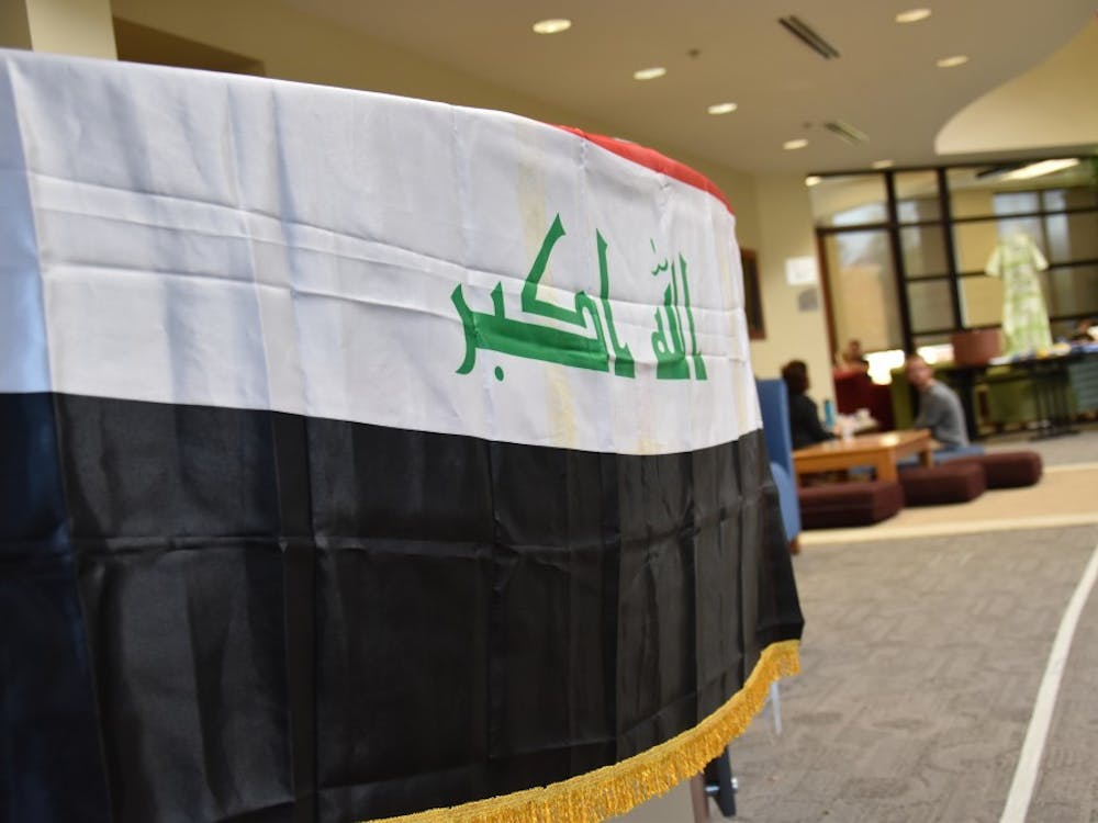 The Iraqi flag sits on a table at the "Because They Are Me" charity event on Nov. 5 at the Innovation Connector. The event was hosted by Muncie locals and refugees from Iraq in an effort to help ease the struggles of refugees in northern Iraq.&nbsp;Patrick Calvert // DN