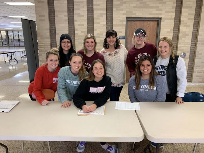 Ball State students, 18 and older, volunteer with MCHS’s food and clothing bank. The high school only allows adults, not MCHS students, volunteer to keep services anonymous. Kenna Jones, Photo provided. 