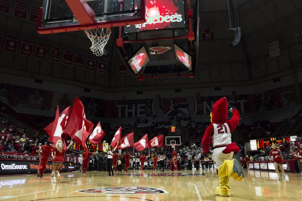 <p>Cheerleaders and Charlie Cardinal run down the court during the second half of a Ball State Men’s Basketball game against Central Michigan, Jan. 16 at John E. Worthen Arena. Ball State defeated Central Michigan, 76-82. <strong>Grace Hollars, DN</strong></p>
