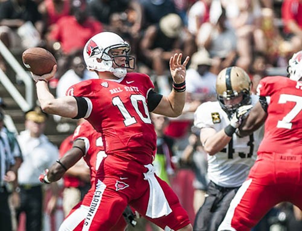 Senior quarterback Keith Wenning prepares to pass the ball down field during the game against Army on Saturday at Scheumann Stadium. Ball State swept Army with a score of 40-14. DN PHOTO JONATHAN MIKSANEK