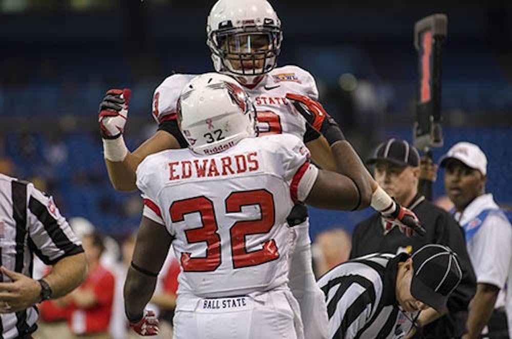 Jahwan Edwards celebrates a touchdown with his team mate. DN PHOTO COREY OHLENKAMP