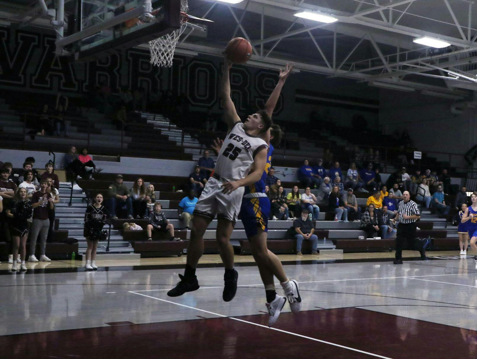 Wes-Del sophomore Josiah Love attempts a layup Nov. 22 in a game against Cambridge City Lincoln at Wes-Del Junior/Senior High School. Zach Carter, DN.